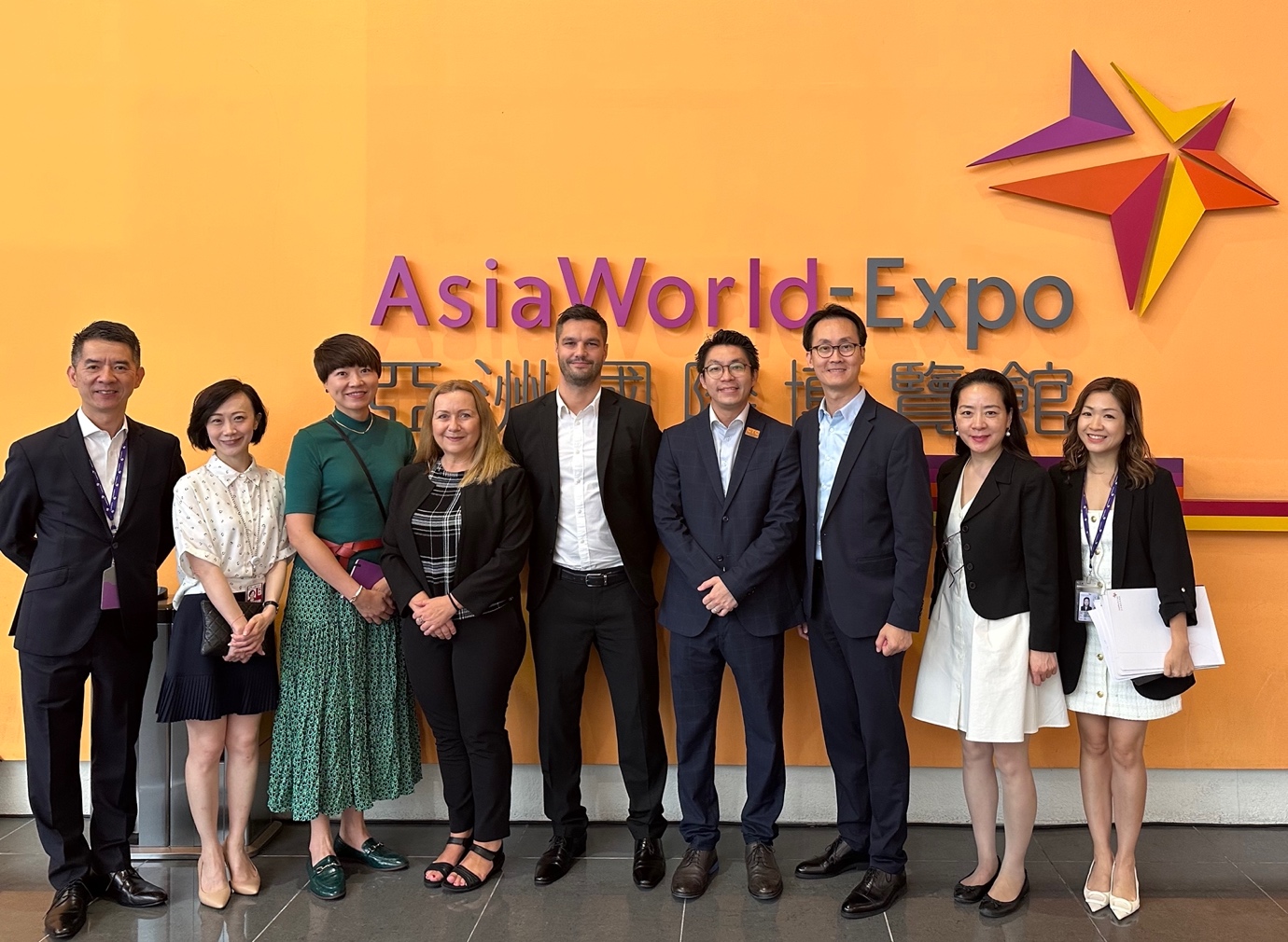 A group of people posing for a photoDescription automatically generated